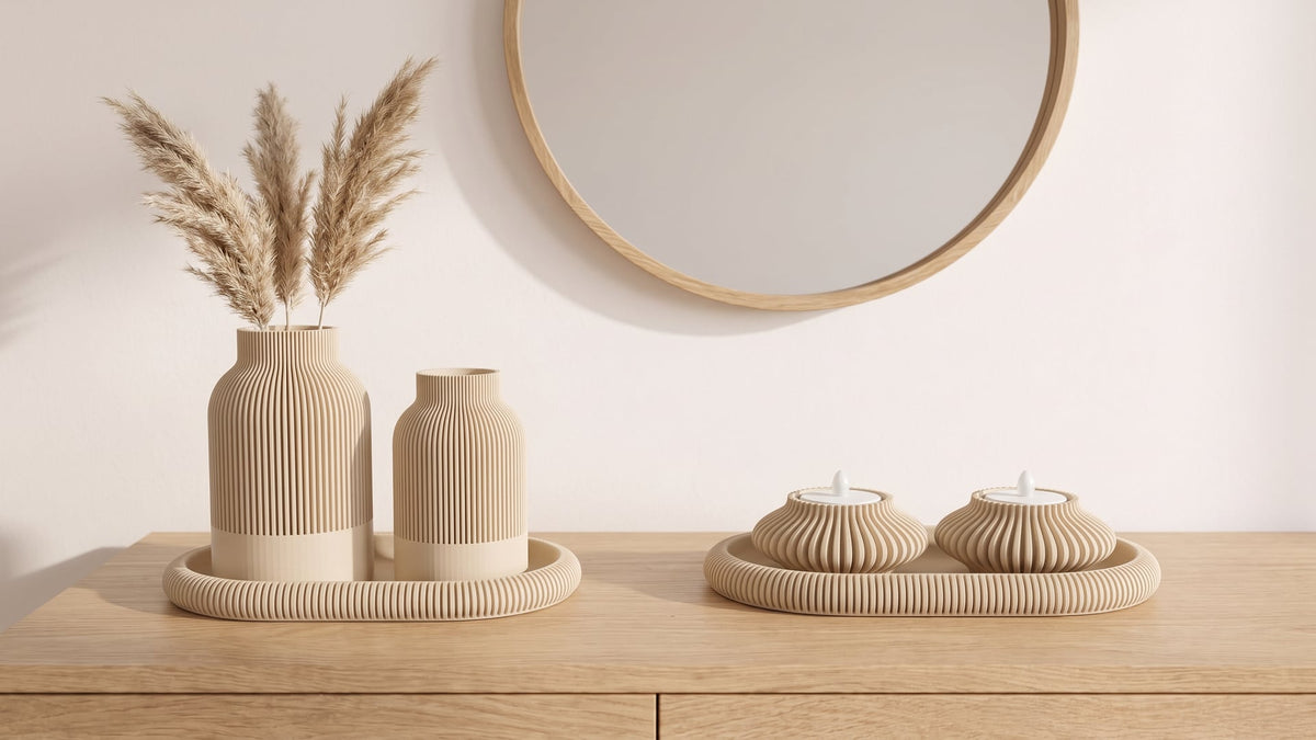 Light oak sideboard under a round oak-framed mirror: beige set of two ribbed vases with dried pampas on an oval tray, and a ribbed tray with two LED tealight holders
